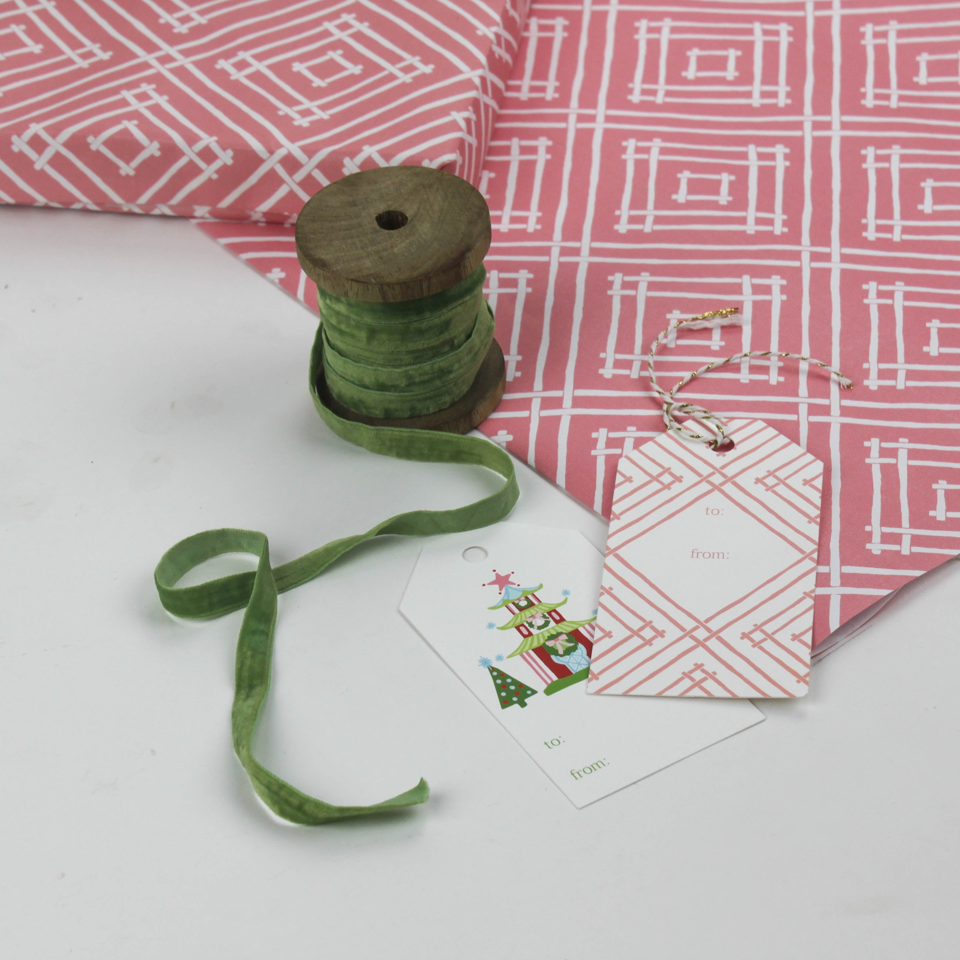 a wrapping paper with a geometric lattice pattern in pink