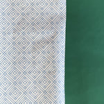 Blue gift wrapping paper with a geometric lattice pattern