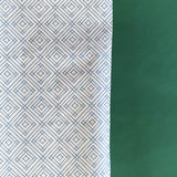 Blue gift wrapping paper with a geometric lattice pattern