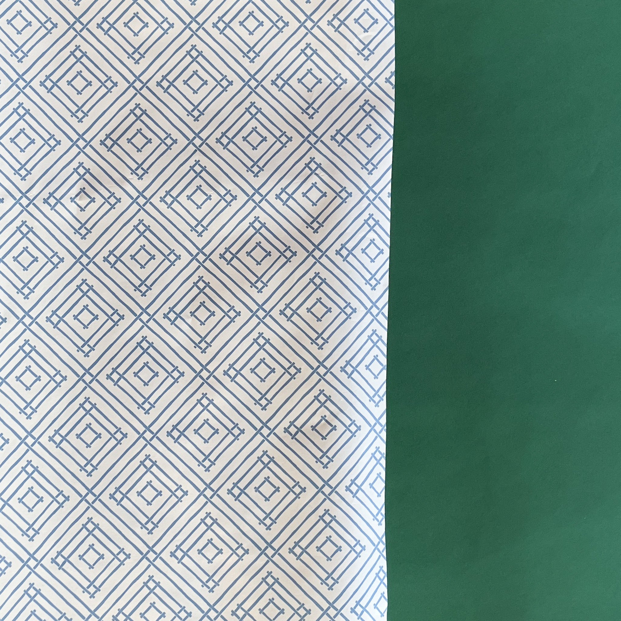 Blue gift wrapping paper with a geometric lattice pattern