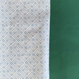 Blue gift wrapping paper with a geometric lattice pattern
