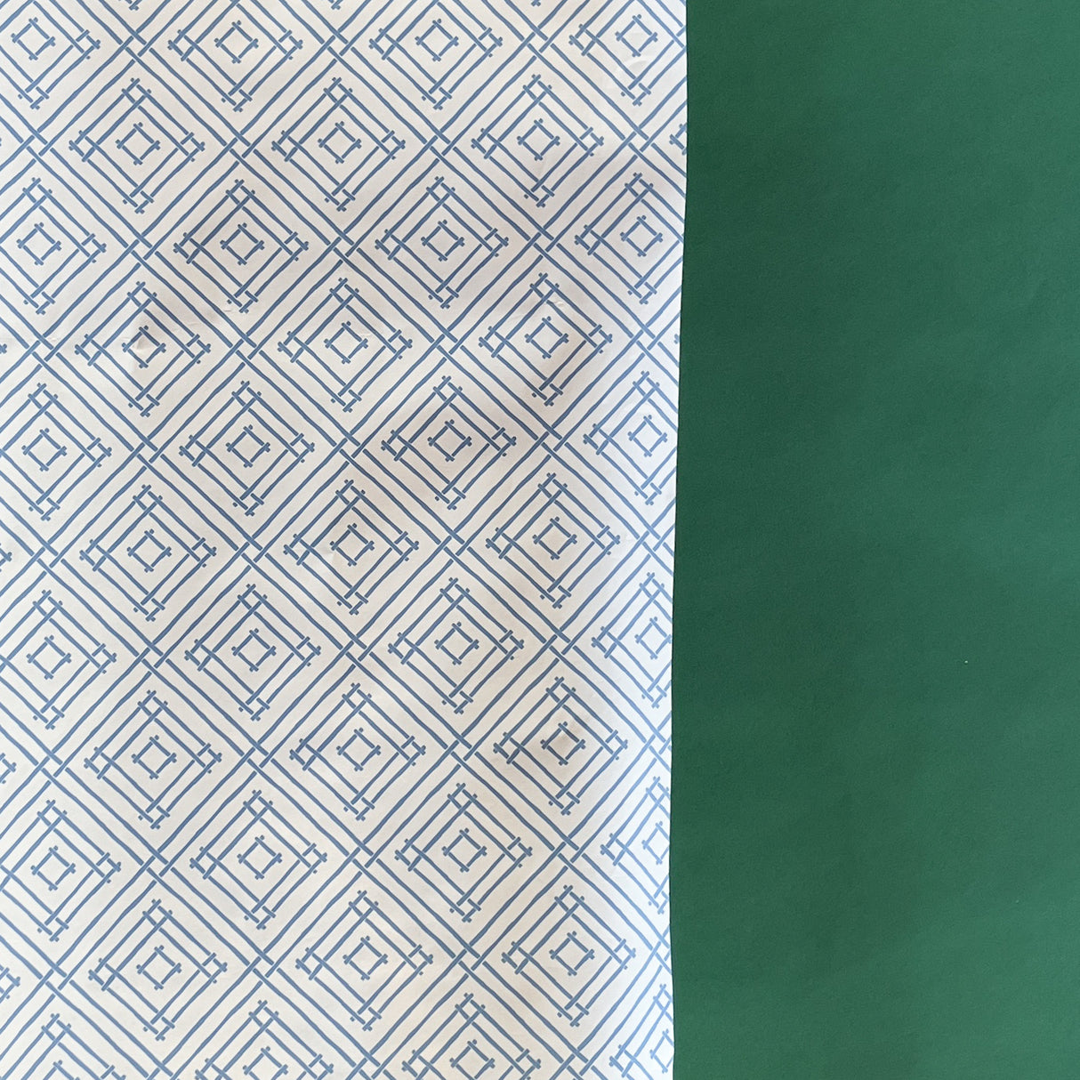 Blue gift wrapping paper with a geometric lattice pattern