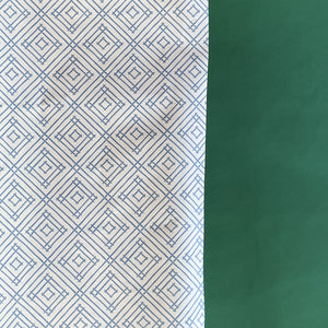 Blue gift wrapping paper with a geometric lattice pattern