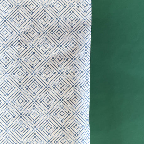 Blue gift wrapping paper with a geometric lattice pattern