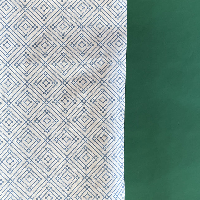 Blue gift wrapping paper with a geometric lattice pattern