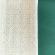 Green gift wrapping paper with a geometric lattice pattern