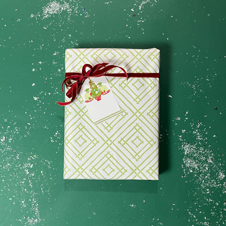 Green gift wrapping paper with a geometric lattice pattern