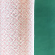 Pink gift wrapping paper with a geometric lattice pattern