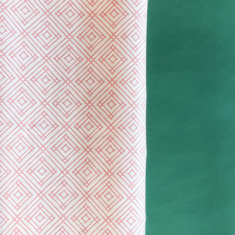 Pink gift wrapping paper with a geometric lattice pattern