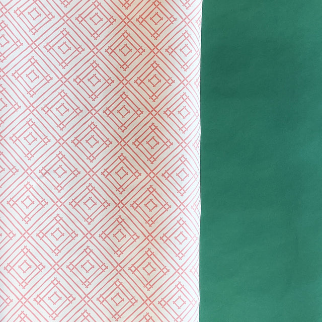Pink gift wrapping paper with a geometric lattice pattern