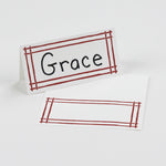 Bamboo Trellis Paper Place Cards in red displayed on white background