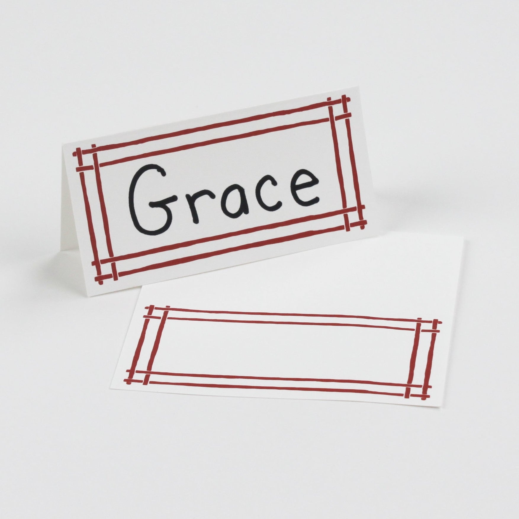 Bamboo Trellis Paper Place Cards in red displayed on white background