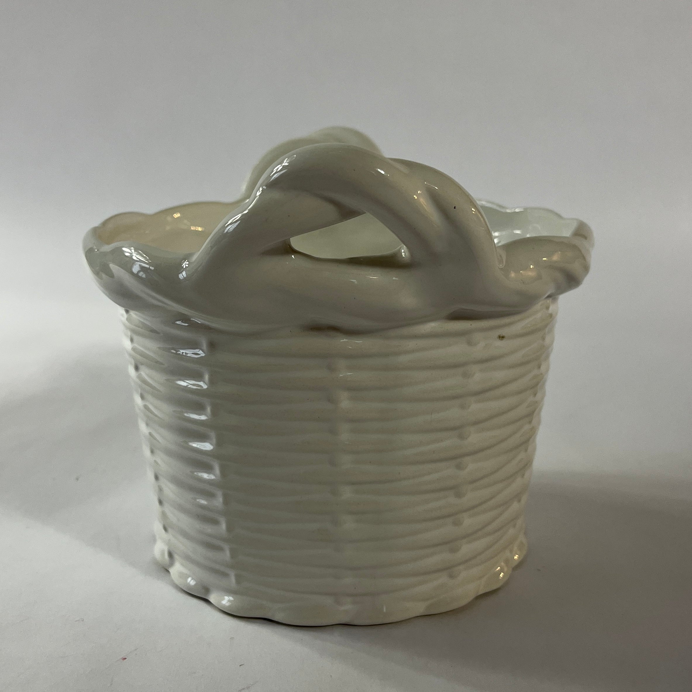 a white vintage italian ceramic basket