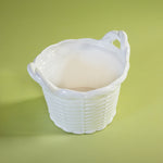 a white vintage italian ceramic basket