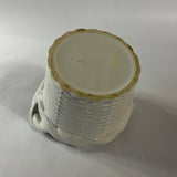 a white vintage italian ceramic basket