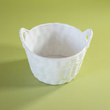 a white vintage italian ceramic basket