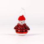Decorative glass snowman ornament with a red hat and sweater on a white background
