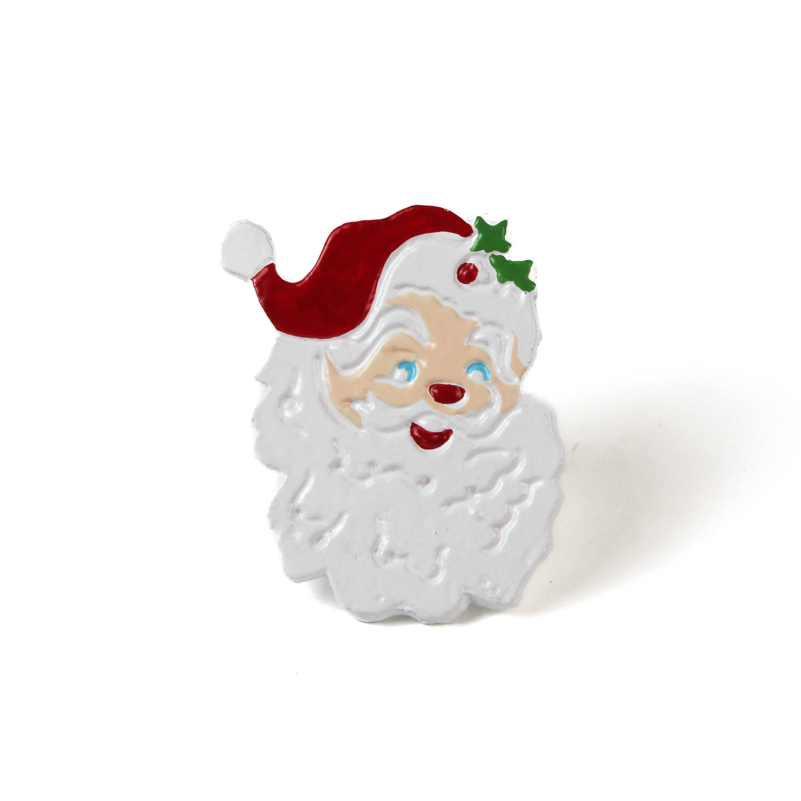 santa christmas napkin ring wiht a smiling face and holly sprig in a red hat on a white background. 