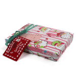 Colorful Christmas wrapping paper featuring santa, candy cane and christmas tree motifs. 