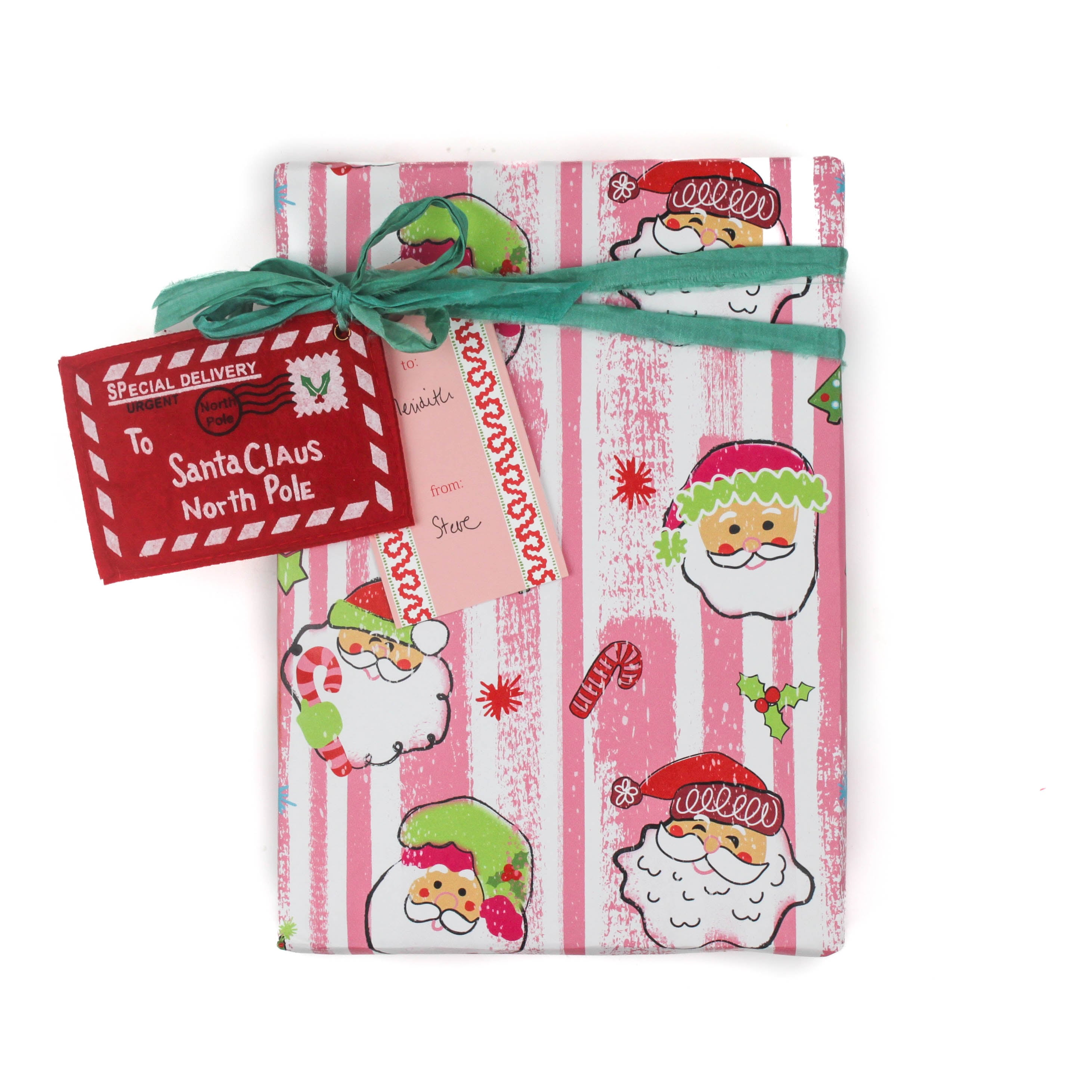 Colorful Christmas wrapping paper featuring santa, candy cane and christmas tree motifs. 