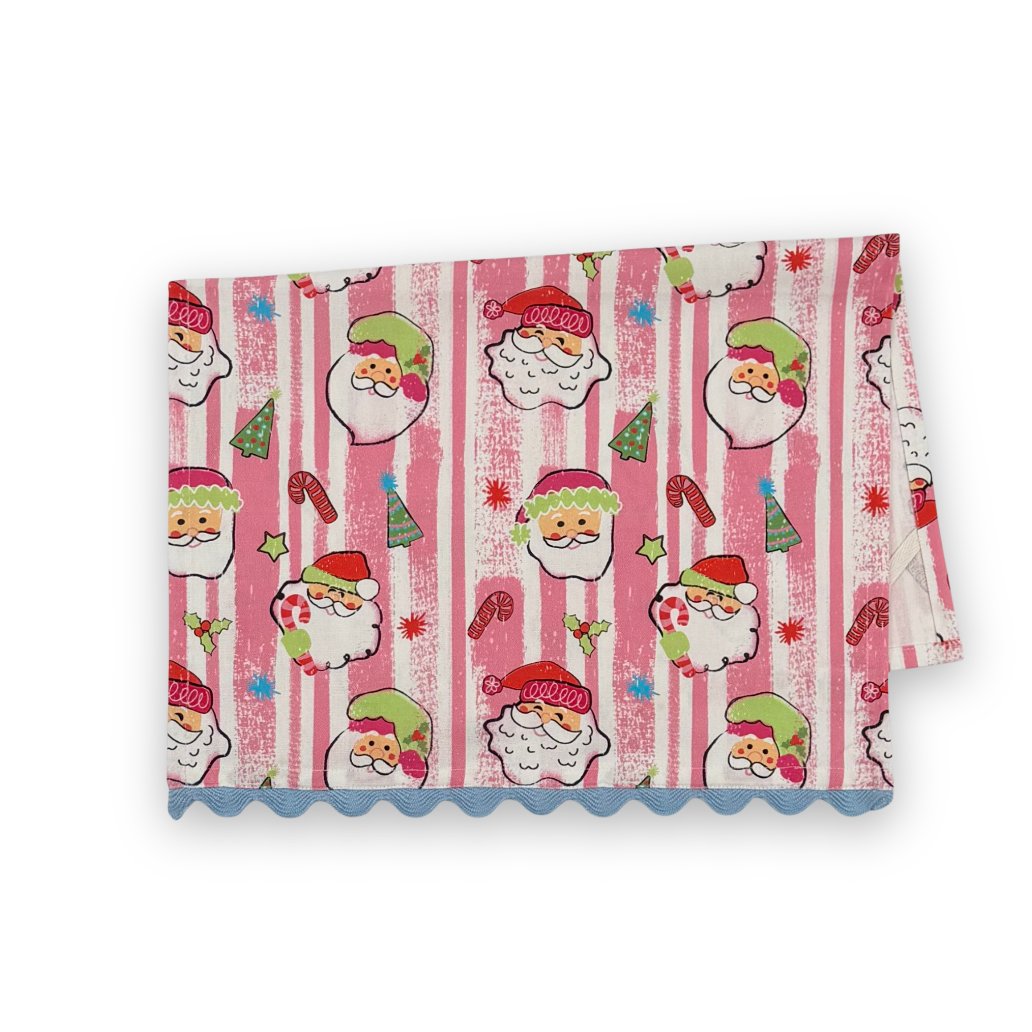 Folded Jolly Santas Christmas cotton tea towel featuring playful Santa faces, festive holiday motifs, pink stripes, and blue scalloped trim.