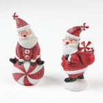 Two Santa Claus table decorations on a white background