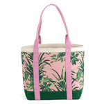 a large Jungle Road canvas tote bag with a pink and green leaf pattern, displayed against a white background.