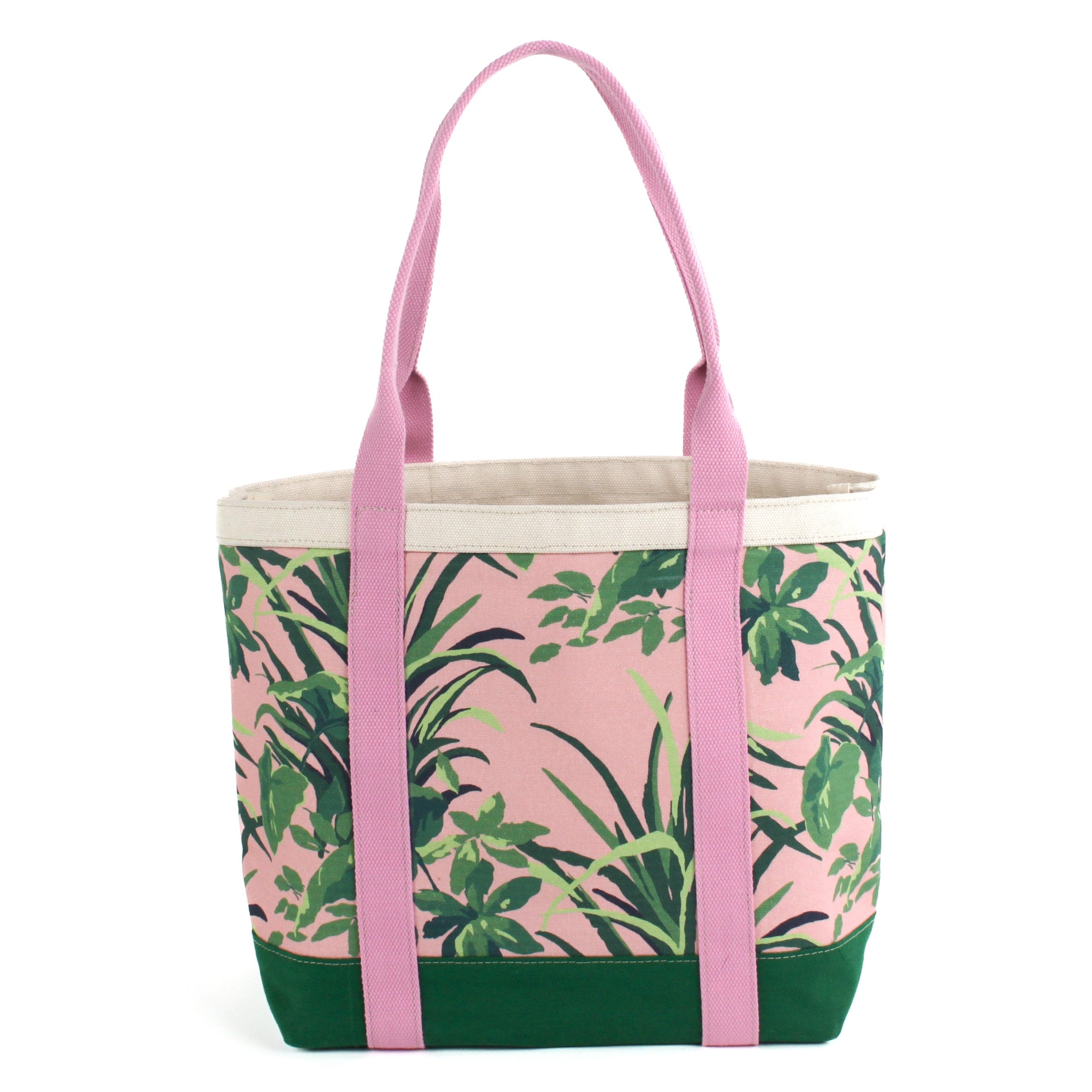a large Jungle Road canvas tote bag with a pink and green leaf pattern, displayed against a white background.