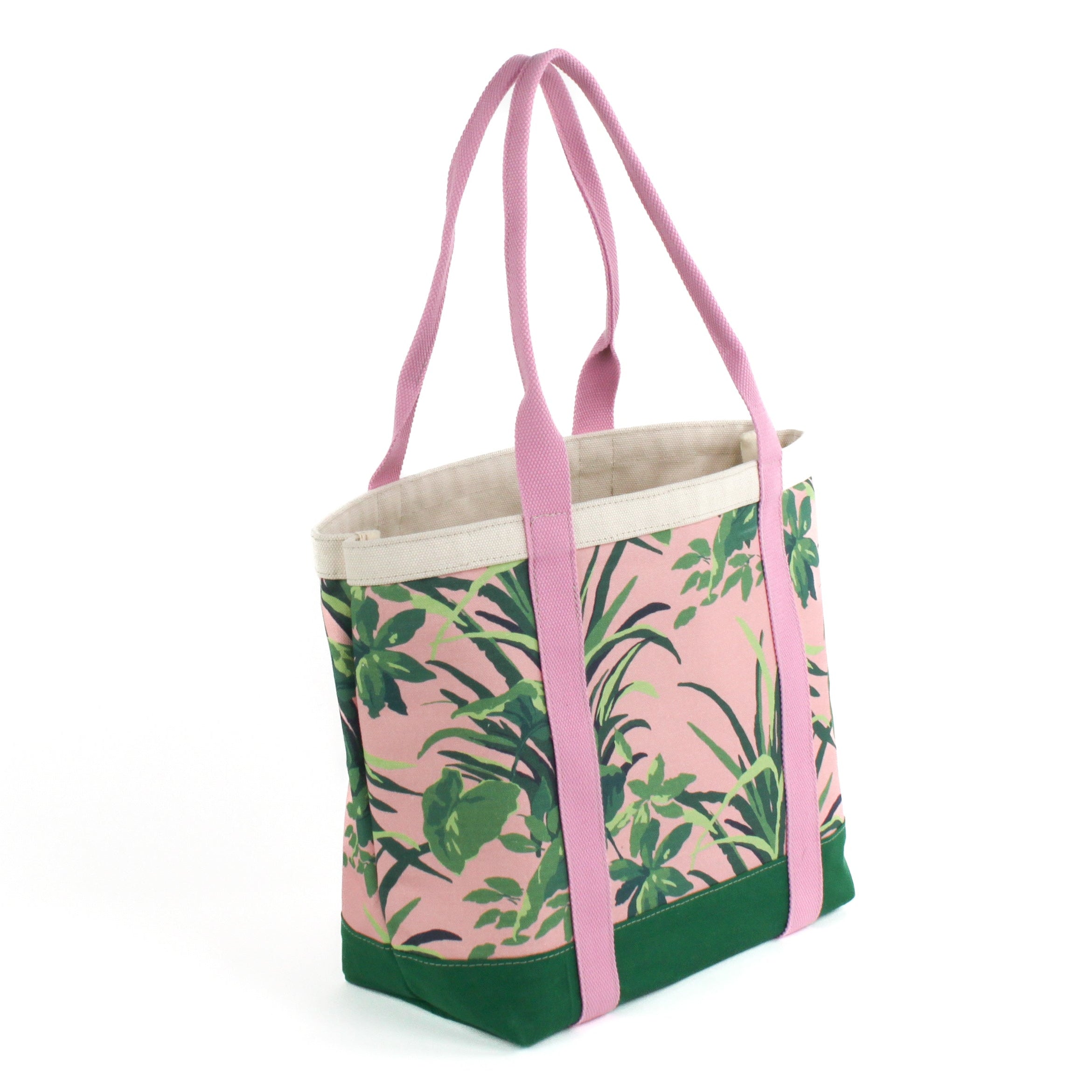 a large Jungle Road canvas tote bags with a pink and green leaf pattern, displayed against a white background.