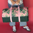 Jungle Road pink and green canvas duffle bag with model 