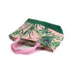 a small Jungle Road canvas tote bags with a pink and green leaf pattern, displayed against a white background.