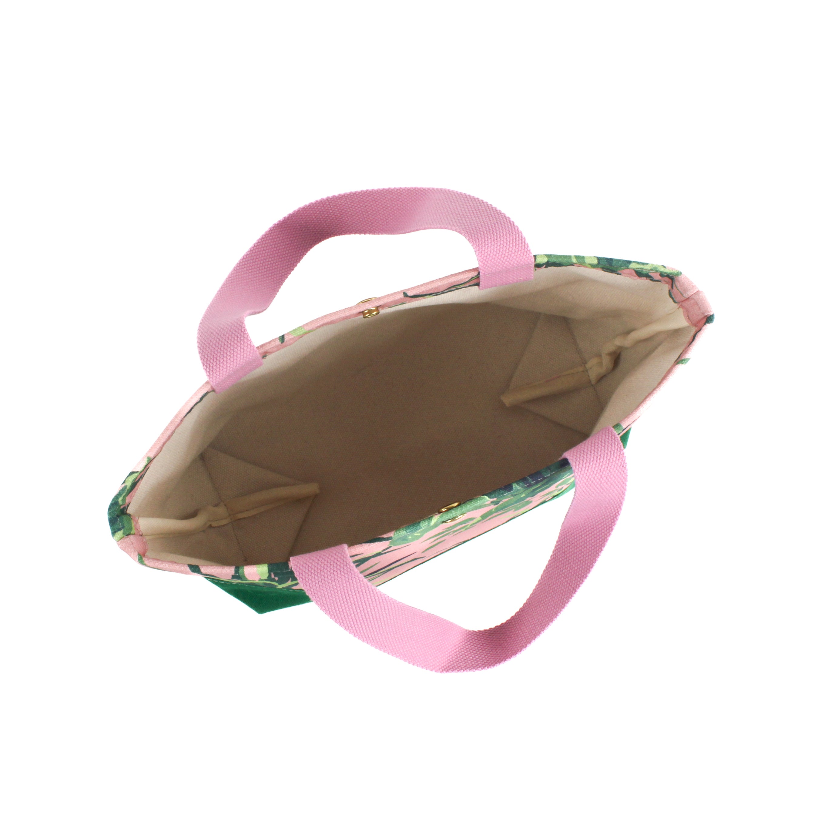 the image shows the inside of a large Jungle Road canvas tote bags with a pink and green leaf pattern, displayed against a white background.