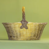 Large brown ceramic basket with woven texture and curved handle