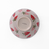 Large ceramic serving bowl with pink strawberry pattern, shown holding green pears bottom