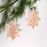 Set of two large wooden star christmas ornaments painted in pink and white with distressed polka dot details