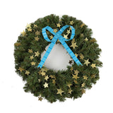 large blue striped bow ornament on a wreath