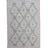 A madcap cottage pink and green striped accent rug with a lattice motif across the front