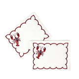 white scalloped cocktail napkins with embroidered red lobster design