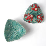 footed stoneware lobster bowls with a white background, 1 showing the bottom