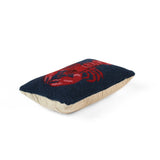 Lobster navy blue throw pillow side view with red lobster design and beige fabric backing.