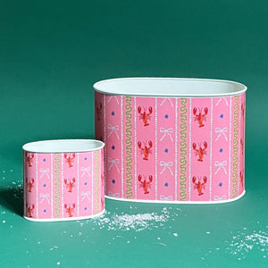 Empty duo of Lobster and Ribbons caddies in large and small on a green background