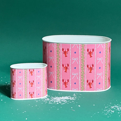Empty duo of Lobster and Ribbons caddies in large and small on a green background