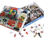 1000-piece London puzzle by Michael Storrings featuring an illustrated scene of iconic London landmarks, double-decker buses, busy streets, and people walking. Product details, artist bio, and puzzle information shown on the packaging.