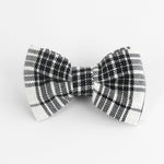 a MacLoecke Black/White Plaid Dog/Cat Bowties in Large placed on a white surface
