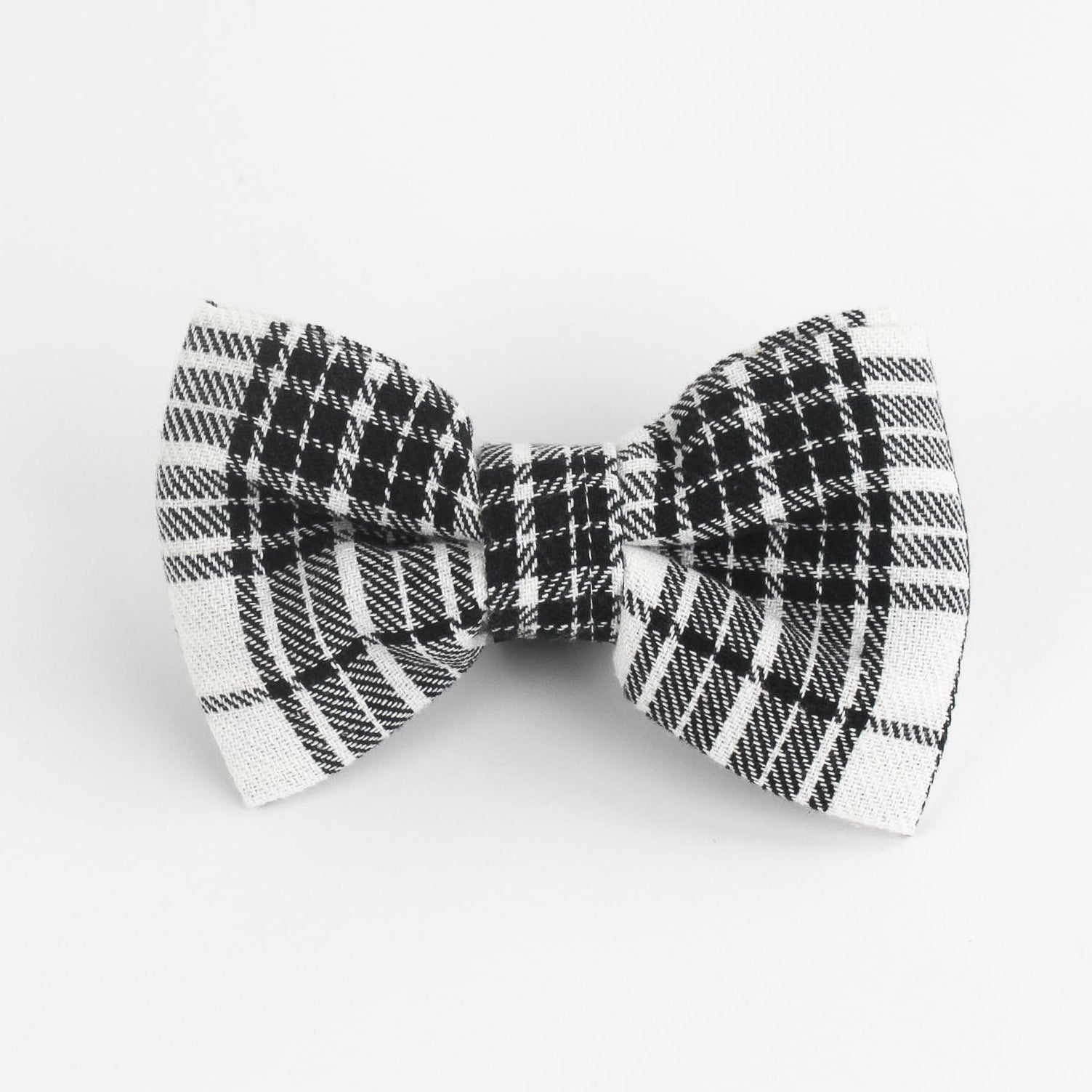 a MacLoecke Black/White Plaid Dog/Cat Bowties in Large placed on a white surface