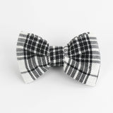 a MacLoecke Black/White Plaid Dog/Cat Bowties in Large placed on a white surface