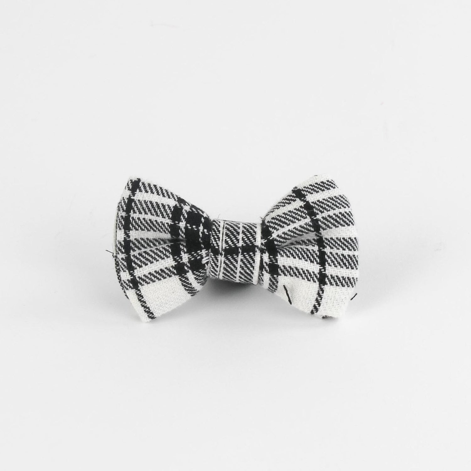 a MacLoecke Black/White Plaid Dog/Cat Bowties in Medium placed on a white surface
