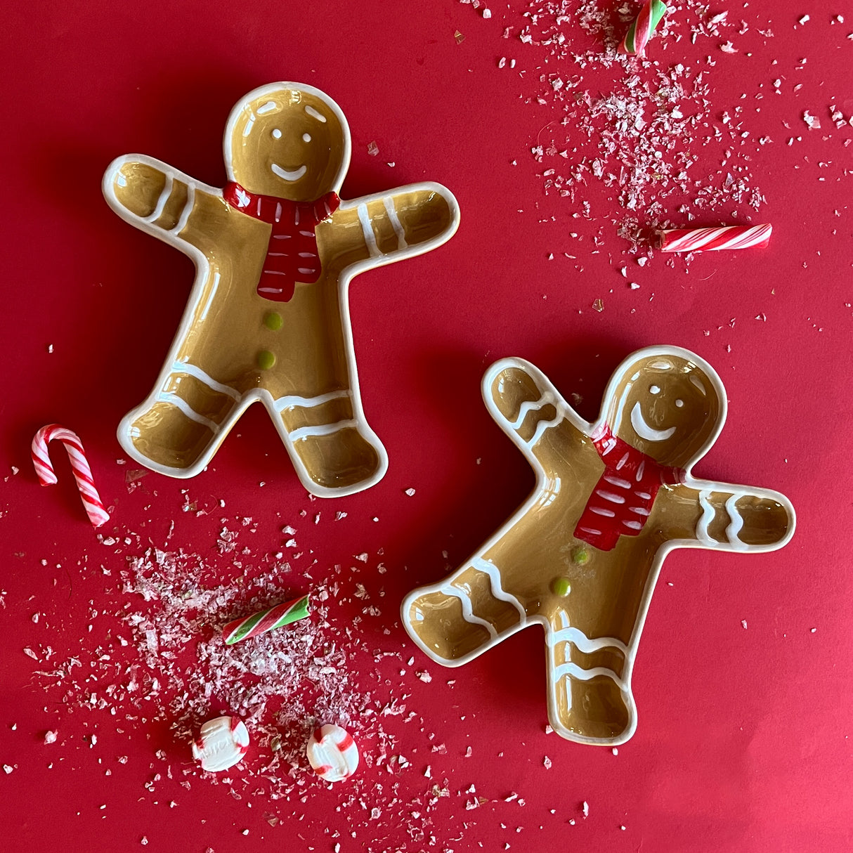 Ceramic gingerbread Christmas accent plate shaped like gingerbread man with red scarf