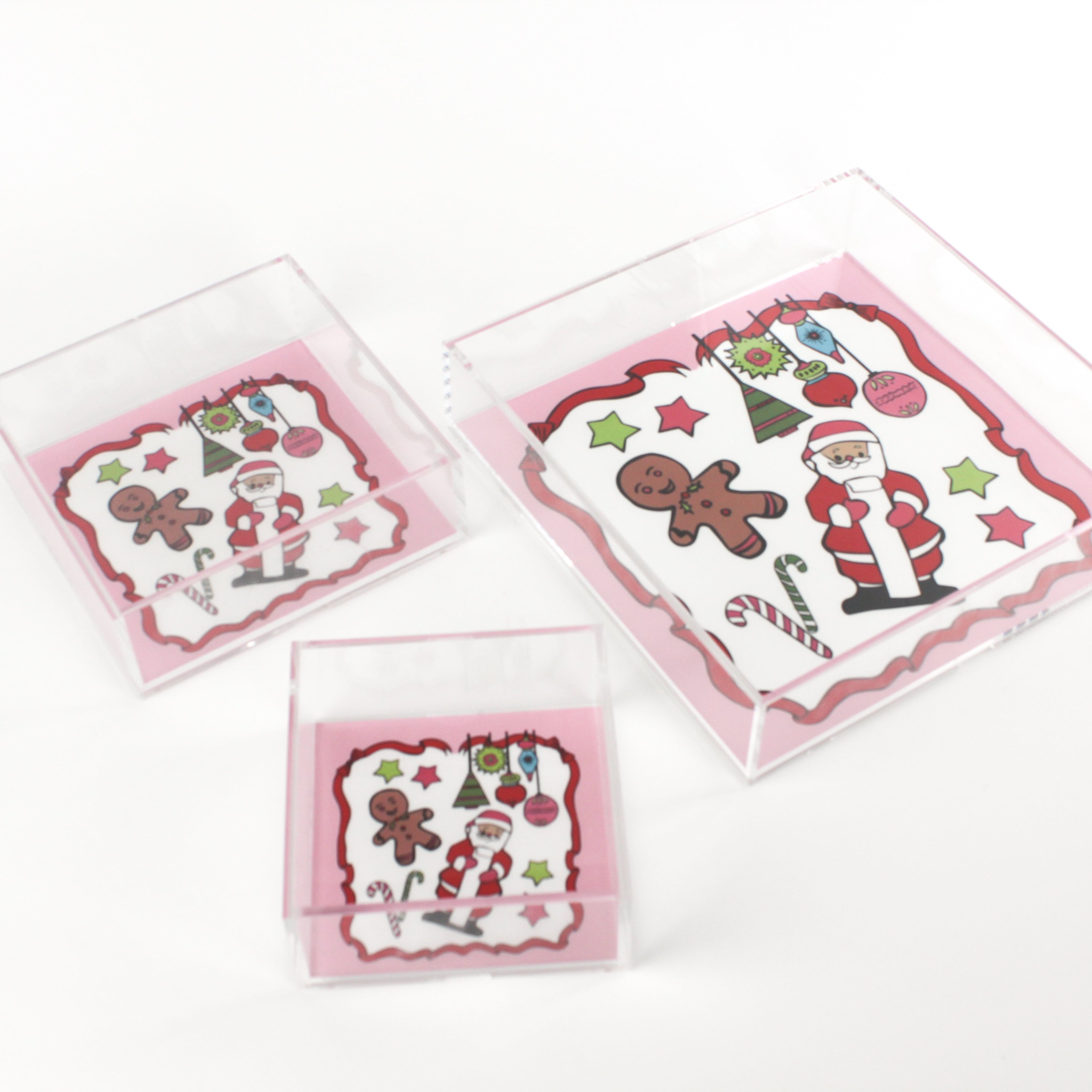 Square acrylic tray with Santa & Friends, stars, ornaments, and candy canes on white background with pink and red border.