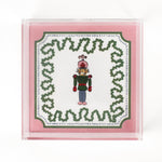 Nutcracker Square Acrylic Tray with in medium size with pink and green border and Nutcracker in the center.